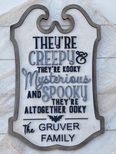 They're Altogether Ooky Family Door Hanger